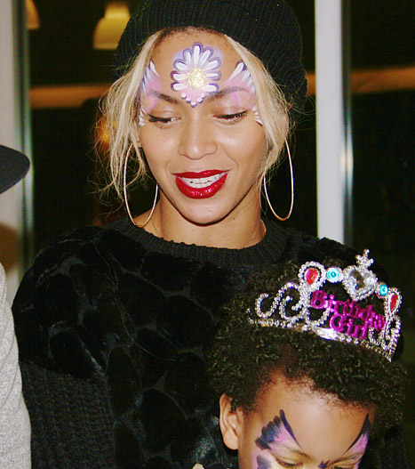 Blue Ivy with a butterfly painted on her face