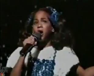 A young Beyonce singing "Home"