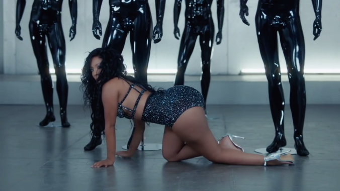 Most of the music video is her seductively crawling around these mannequins. 